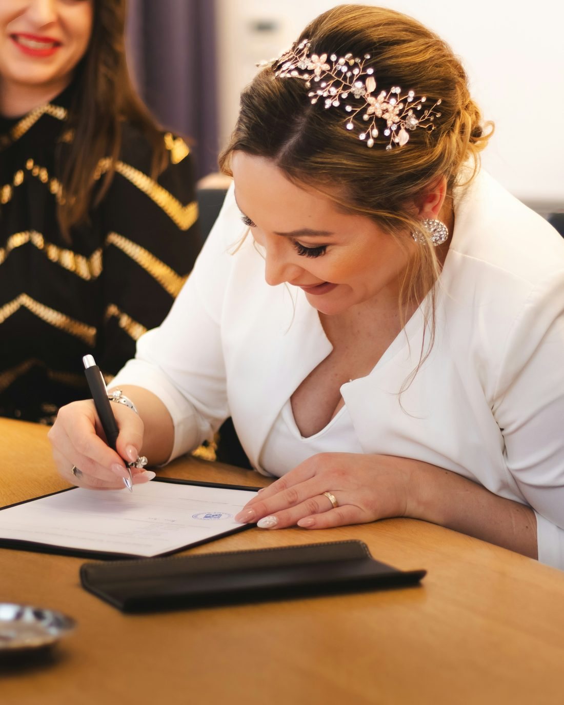 A bride signing the marriage certificate
